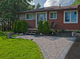 SOLD - Beautiful Country Bungalow on Half Acre Lot, backing onto 1,000 acres of Forever Green Space